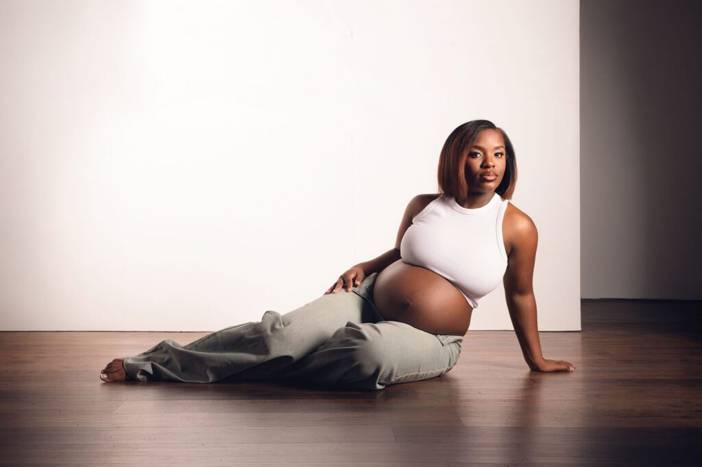 Modern maternity portrait in Huntsville Alabama of expecting mother in simple studio setting